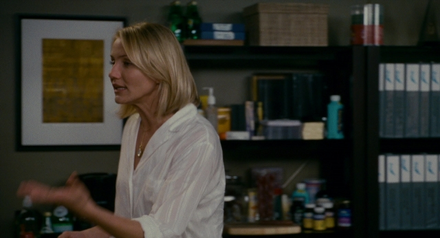 Wide shot frame from The Holiday — book, standing, room