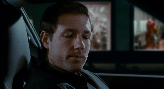Wide shot frame from The Holiday — room, car, mustache
