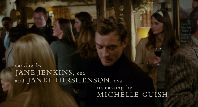 Wide shot frame from The Holiday — room, dialogue, coat