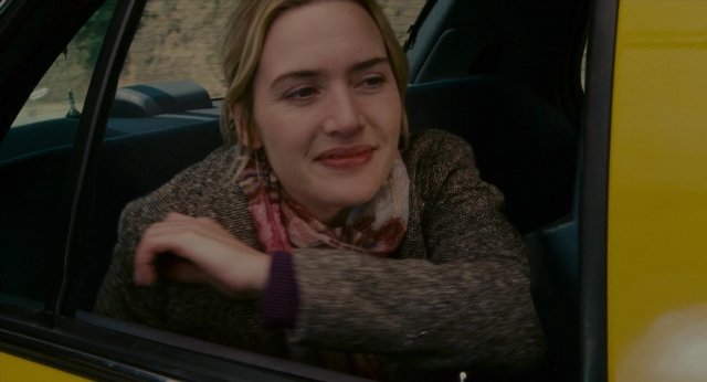 Medium shot frame from The Holiday — sitting, street, car