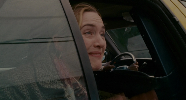 Wide shot frame from The Holiday — sitting, street, car