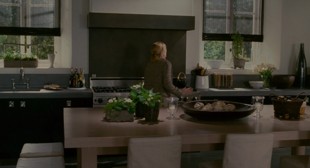 Wide shot frame from The Holiday — standing, table, kitchen
