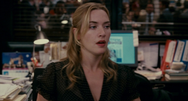 Medium shot frame from The Holiday — sitting, office, face