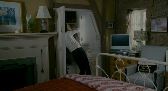 Frame from The Holiday — standing, room, table