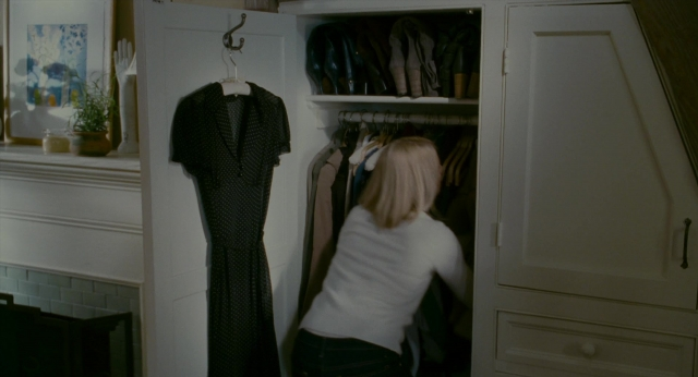 Wide shot frame from The Holiday — standing, door, dress
