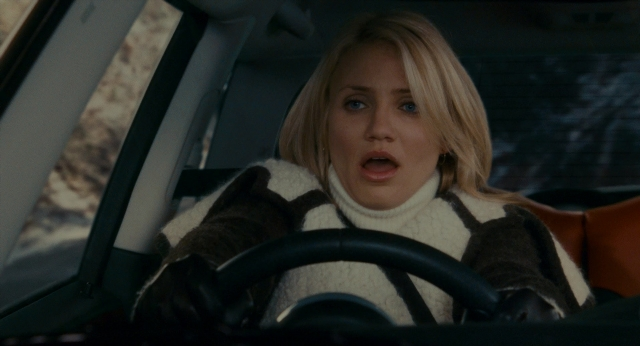 Medium shot frame from The Holiday — sitting, car, face