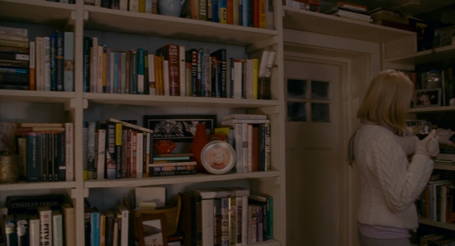Wide shot frame from The Holiday — book, standing, room