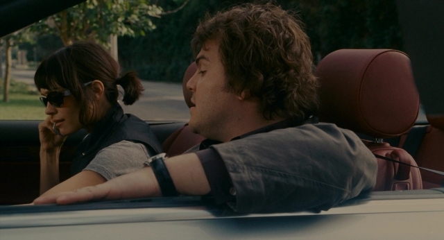 Wide shot frame from The Holiday — sitting, street, car