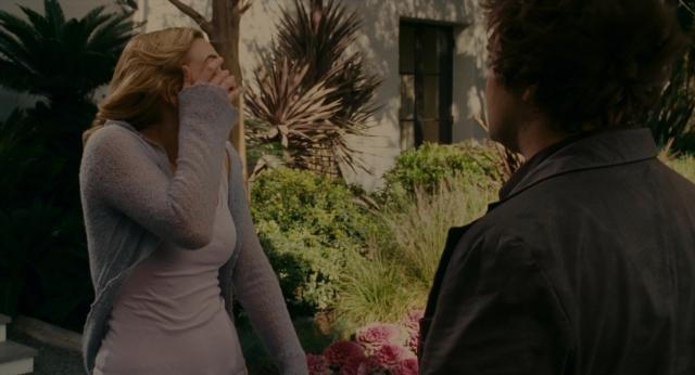 Wide shot frame from The Holiday — standing, door, face