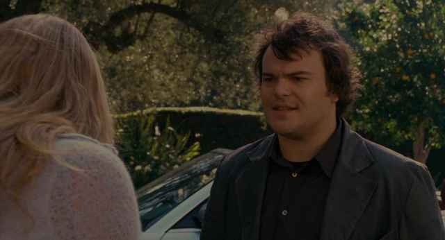 Wide shot frame from The Holiday — standing, street, car