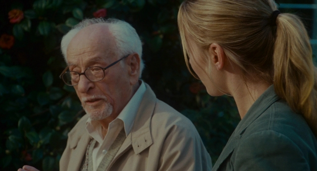 Frame from The Holiday — standing, beard, face