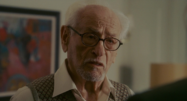 Wide shot frame from The Holiday — room, shirt, face