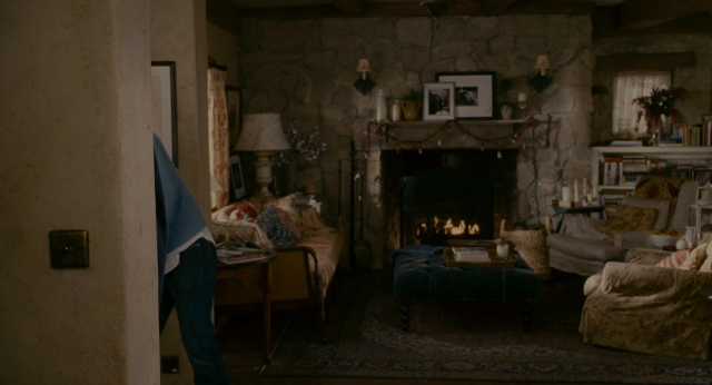 Wide shot frame from The Holiday — book, standing, room