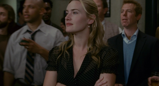 Medium shot frame from The Holiday — room, suit, face