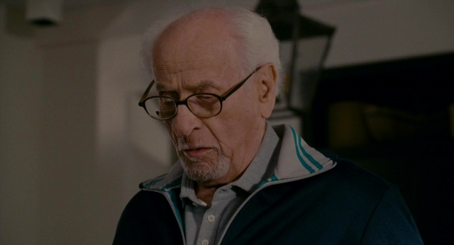Close-up frame from The Holiday — room, couch, face