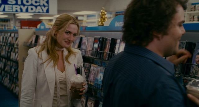 Wide shot frame from The Holiday — standing, hand, face