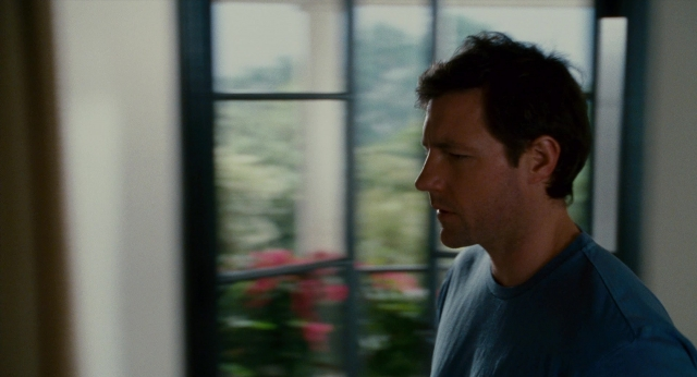 Wide shot frame from The Holiday — standing, shirt, face