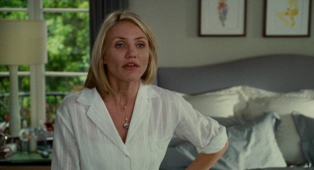 Medium shot frame from The Holiday — standing, room, bed