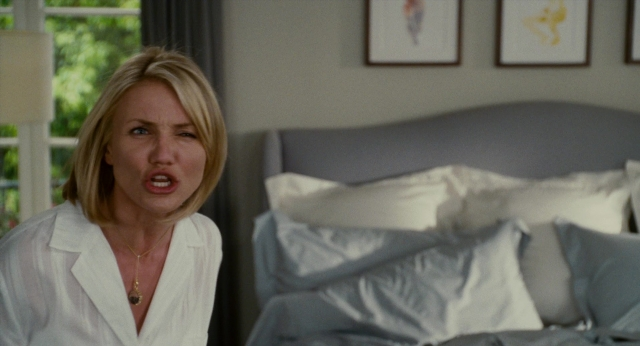 Wide shot frame from The Holiday — sitting, bed, bedroom
