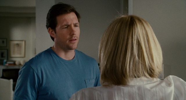 Wide shot frame from The Holiday — standing, room, kitchen