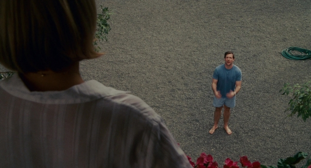 Wide shot frame from The Holiday — standing, shirt, face