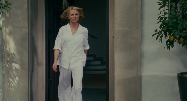 Wide shot frame from The Holiday — walking, door, face
