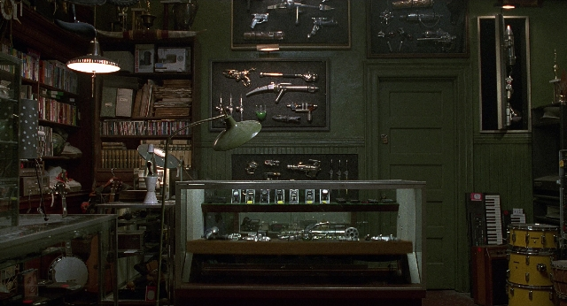 Wide shot frame from Men in Black — book, room, door