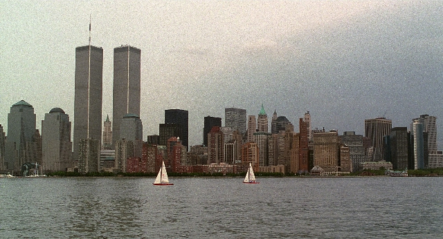Wide shot frame from Men in Black — water, tower, skyscraper