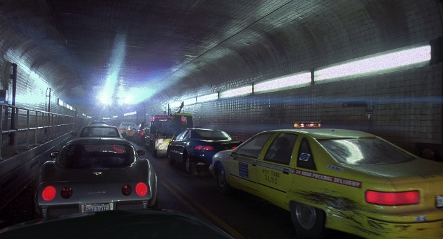 Wide shot frame from Men in Black — street, fire, car