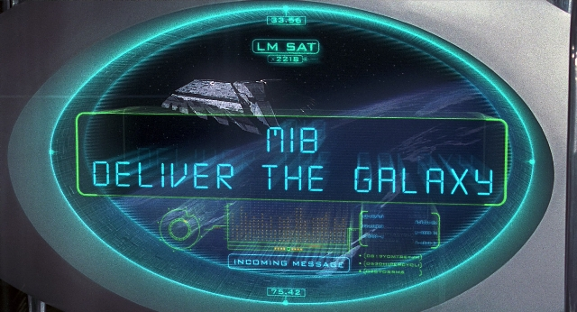 Wide shot frame from Men in Black — digital clock