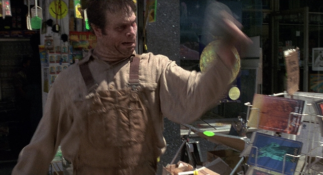 Wide shot frame from Men in Black — standing, shirt, face