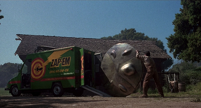 Wide shot frame from Men in Black — standing, street, face