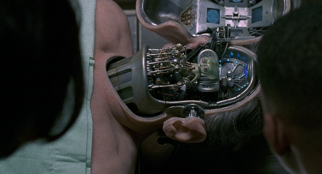 Wide shot frame from Men in Black — face, person, human ear