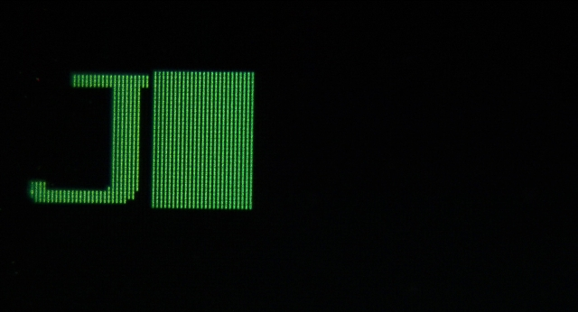 Wide shot frame from Men in Black — clock, digital clock