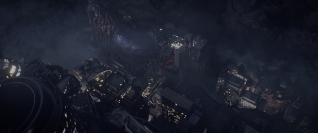 Wide shot frame from Mortal Engines — night, smoke, building
