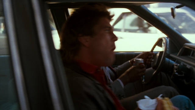 Frame from Lethal Weapon — sitting, street, car
