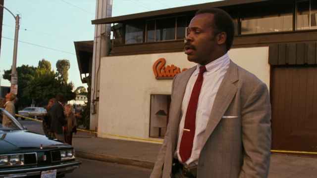 Wide shot frame from Lethal Weapon — standing, walking, street