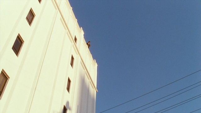 Wide shot frame from Lethal Weapon — window, building