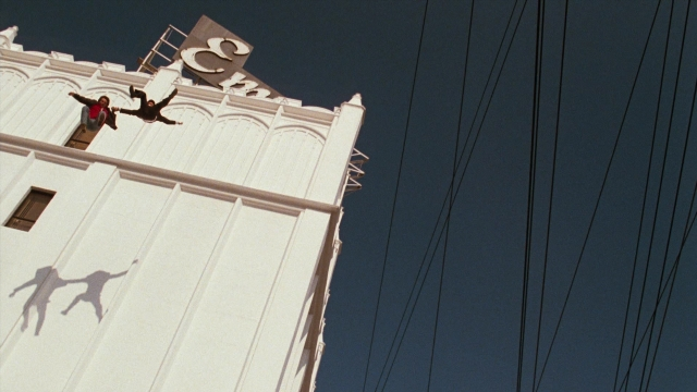 Wide shot frame from Lethal Weapon — person, window, building
