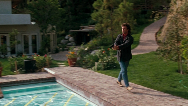 Wide shot frame from Lethal Weapon — walking, house, face