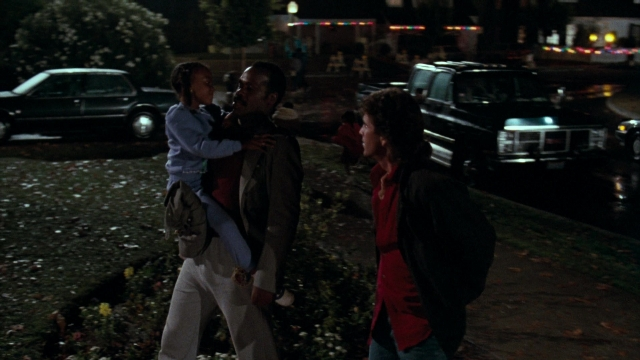 Frame from Lethal Weapon — walking, street, car