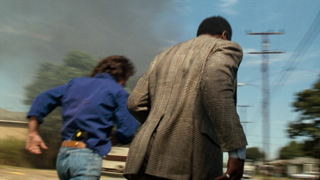 Frame from Lethal Weapon — walking, street, hand