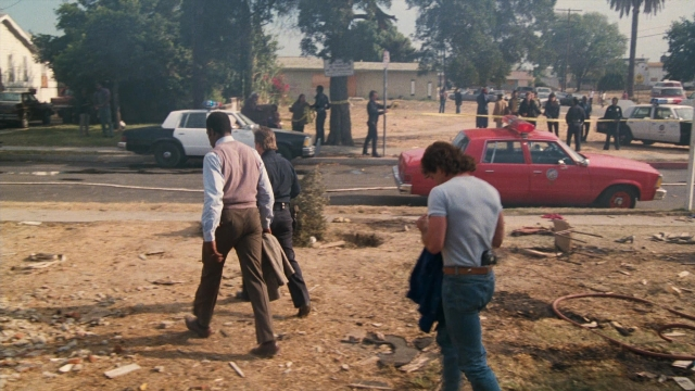 Wide shot frame from Lethal Weapon — standing, walking, street
