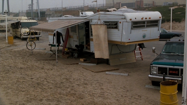 Frame from Lethal Weapon — table, car, chair