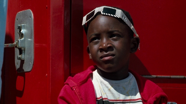 Medium shot frame from Lethal Weapon — standing, door, shirt
