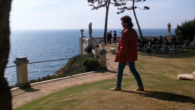 Wide shot frame from Lethal Weapon — standing, walking, coat