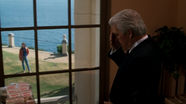 Wide shot frame from Lethal Weapon — standing, walking, suit