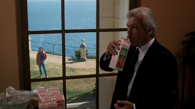 Wide shot frame from Lethal Weapon — standing, walking, table