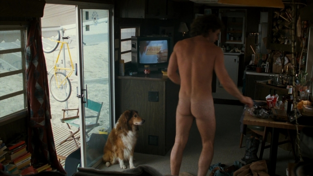 Wide shot frame from Lethal Weapon — sitting, standing, room