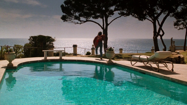 Wide shot frame from Lethal Weapon — standing, water, chair